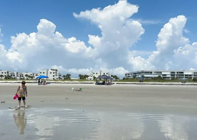 Child Playing On The Beach